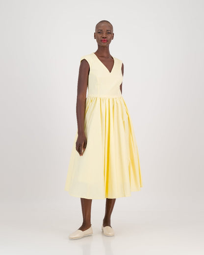 Step into sunshine with Bella, a radiant sleeveless linen dress in a striking yellow shade. Its semi-princess style lines create a flattering silhouette by cinching the waist, while the full gathered skirt adds movement and grace. With a below-knee length, Bella is the epitome of effortless chic, ideal for both casual outings and special occasions.